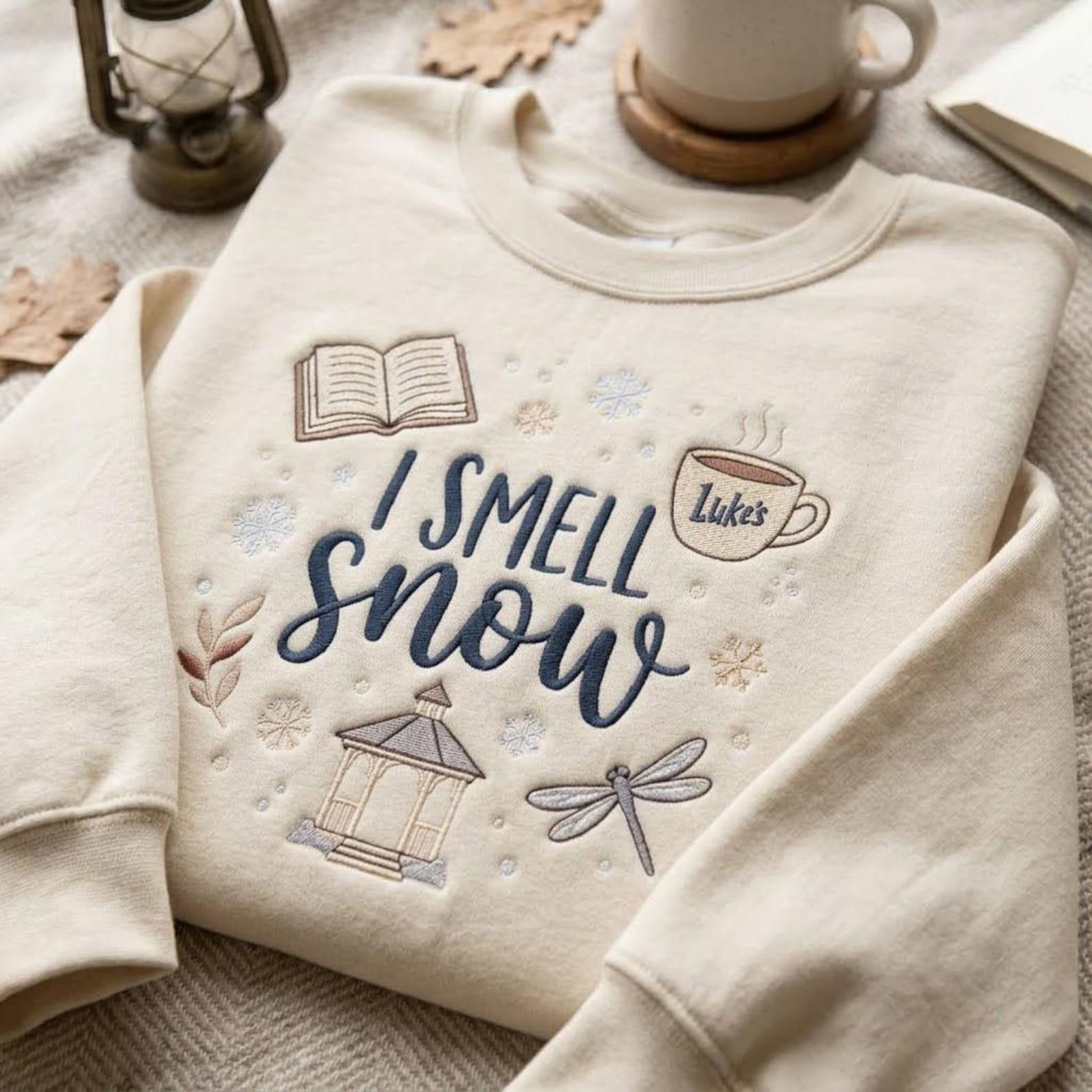 Embroidered I Smell Snow Sweatshirt, Cozy Bookish Winter Crewneck, Coffee Cup Gazebo Dragonfly Design, Autumn Lover Gift Idea 1