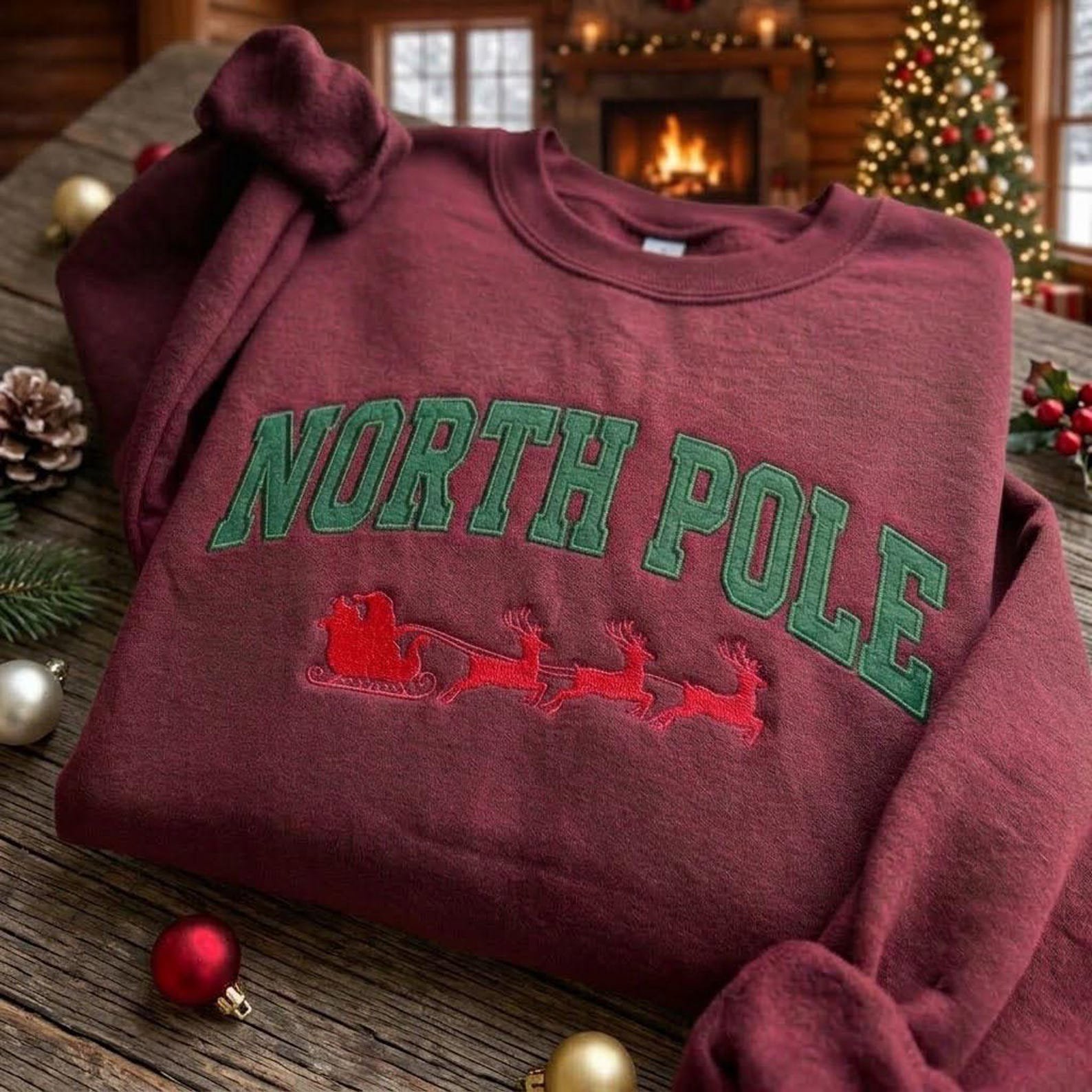 North Pole Christmas Embroidered Sweatshirt, Santa Sleigh Reindeer Crewneck, Collegiate Holiday Sweater, Festive Winter Pullover 3