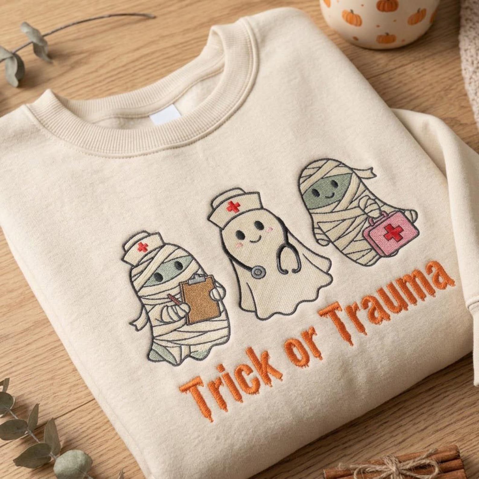 Trick or Trauma Embroidered Sweatshirt, Halloween Nurse Ghost and Mummy Crewneck, Cute Spooky RN Medical Staff Gift 2