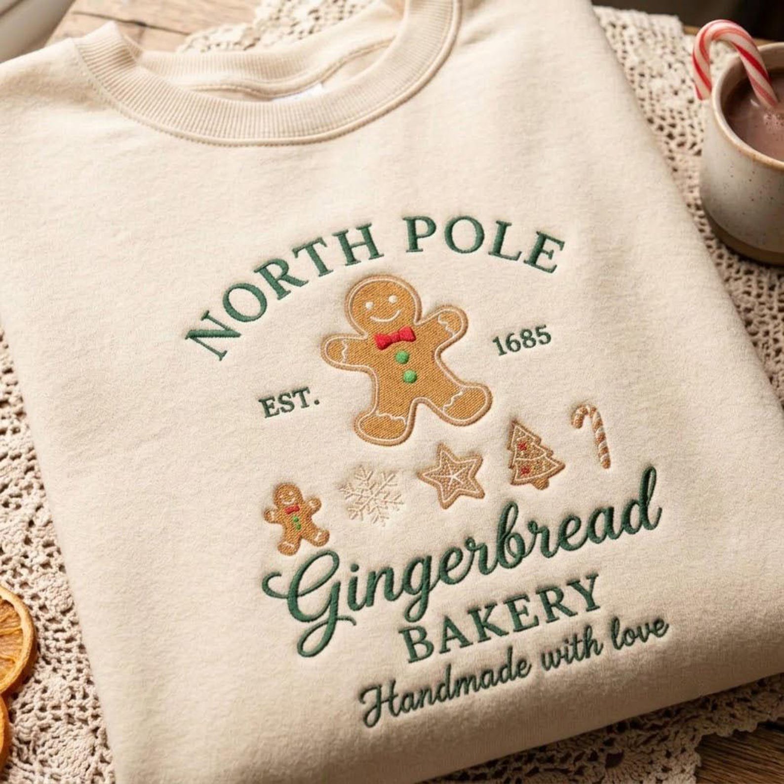 North Pole Gingerbread Bakery Embroidered Sweatshirt, Christmas Gingerbread Man Crewneck, Cute Holiday Baking Sweater, Christmas Gift 1