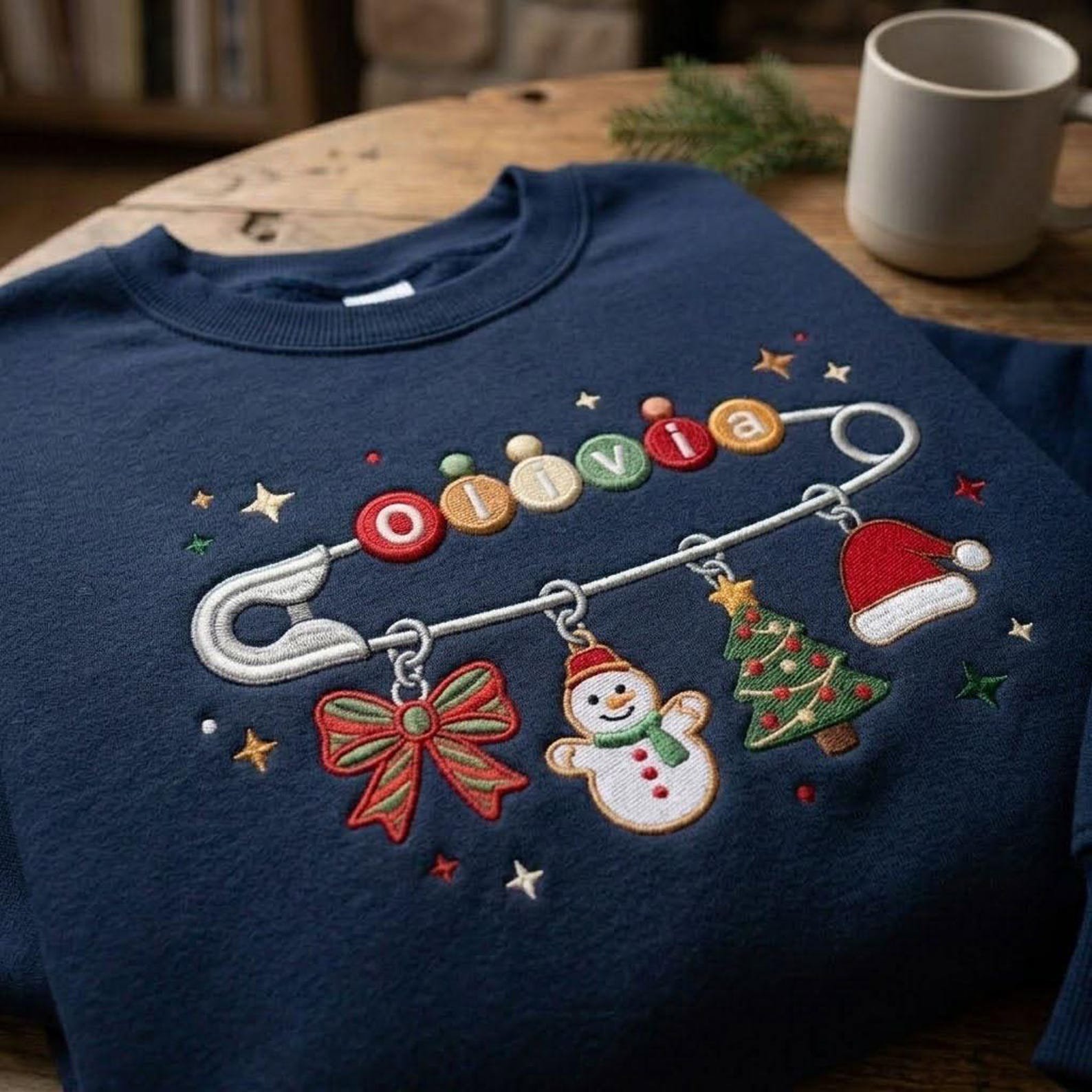 Personalized Christmas Name Sweatshirt, Custom Embroidered Safety Pin Crewneck, Holiday Charm Sweater, Christmas Family Gift 2
